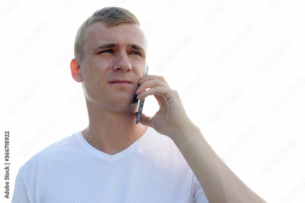 Portrait of young blond man against view of the clear sky Portrait of young blond man against view of the clear sky