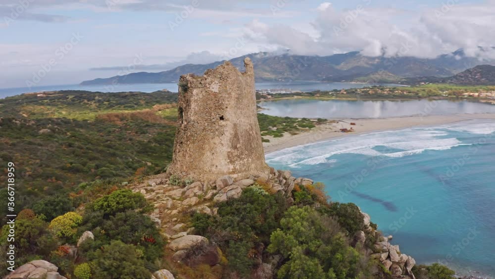View from flying drone. Perfect spring scene of Torre di Porto Giunco tower on Carbonara cape. Aerial morning view of Sardinia island, Italy, Europe. 4K video (Ultra High Definition). View from flying drone. Perfect spring scene of Torre di Porto Giunco tower on Carbonara cape. Aerial morning view of Sardinia island, Italy, Europe. 4K video (Ultra High Definition).