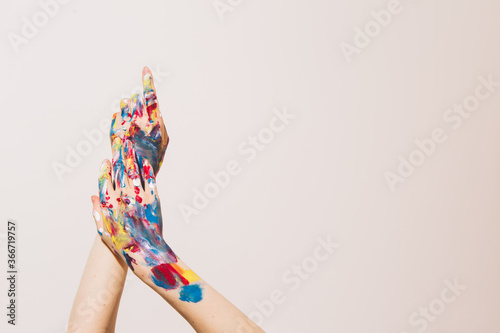 Woman's artist's hands in paints isolated on a white background. Concept photography for art or women's blog