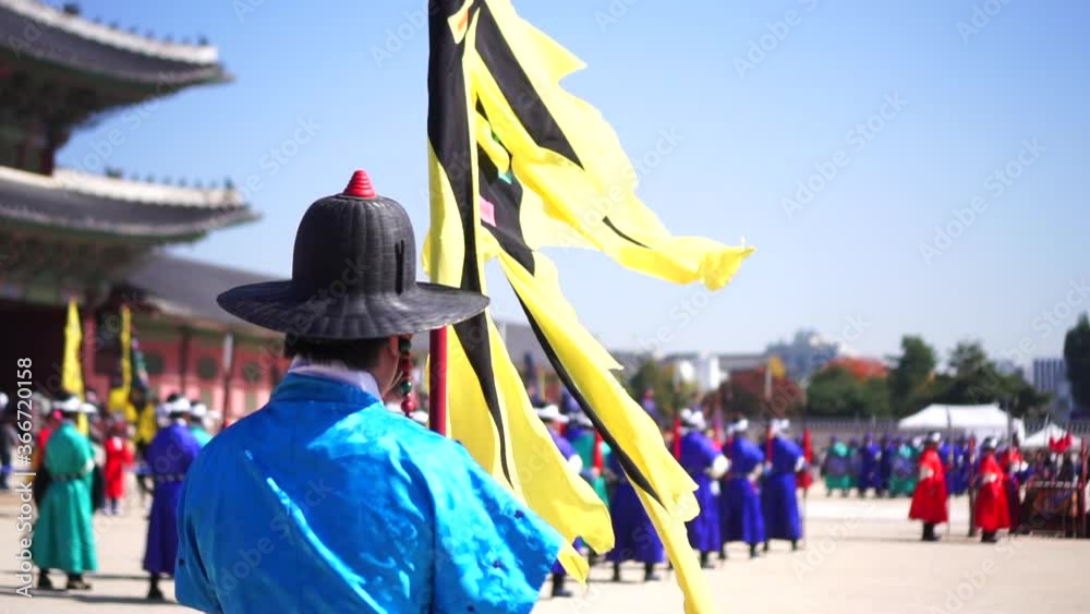 Slow motion of royal guard holding flag at Gyeongbokgung Palace