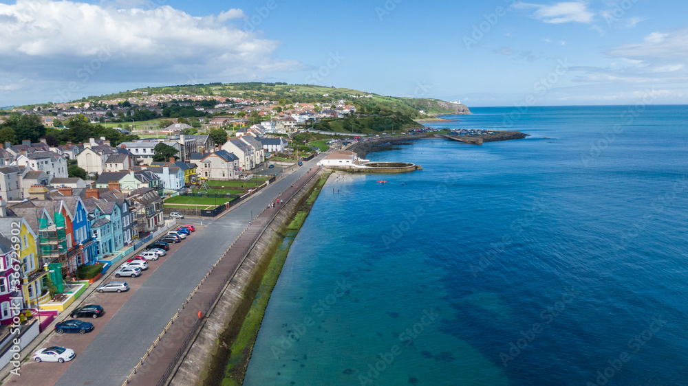 Aerial view on coast in Whitehead, Northern Ireland. Drone photo of town and water of Irish Sea Aerial view on coast in Whitehead, Northern Ireland. Drone photo of town and water of Irish Sea