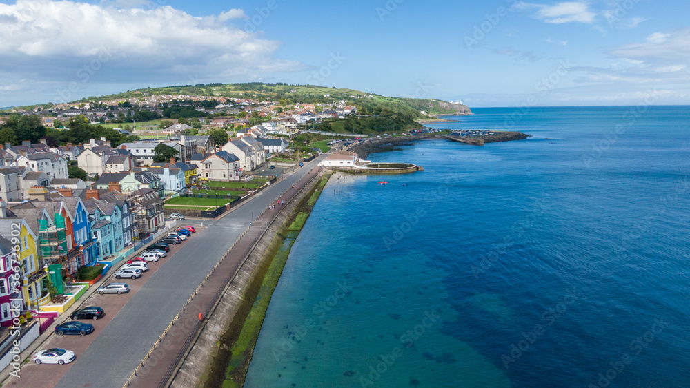 Aerial view on coast in Whitehead, Northern Ireland. Drone photo of town and water of Irish Sea 