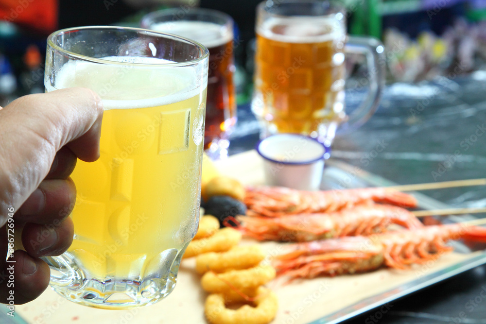 Beer pub. Langoustines and beer. Beer and seafood snacks. Langoustines, beer, squid rings. Beer pub. Langoustines and beer. Beer and seafood snacks. Langoustines, beer, squid rings.
