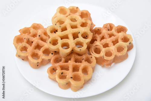 Photography Indian fried snack Achappam or Rosette Cookie is a traditional and popular deep fried snack at tea time Kerala  India during festival christmas, Onam, Vishu