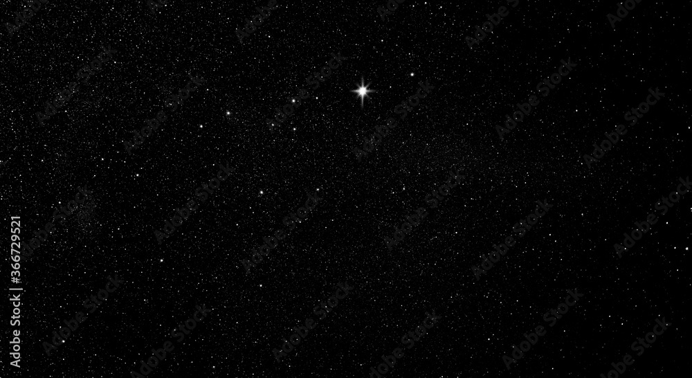 Fototapeta premium Leuchtender Stern im Sternenhimmel