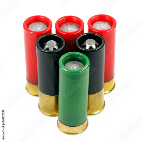 Bullet cartridges for the shotgun isolated on white background. Firearms ammunition.