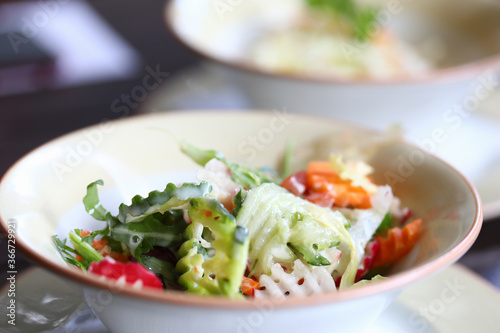 Vegetable salad stands on the table closeup. Healthy lifestyle and proper nutrition concept