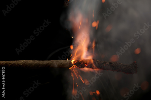 Fuse is burning in the night closeup