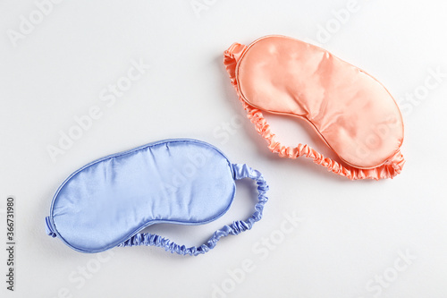 Top view shot of sleeping mask isolated on bright background. Close up, copy space, flat lay.