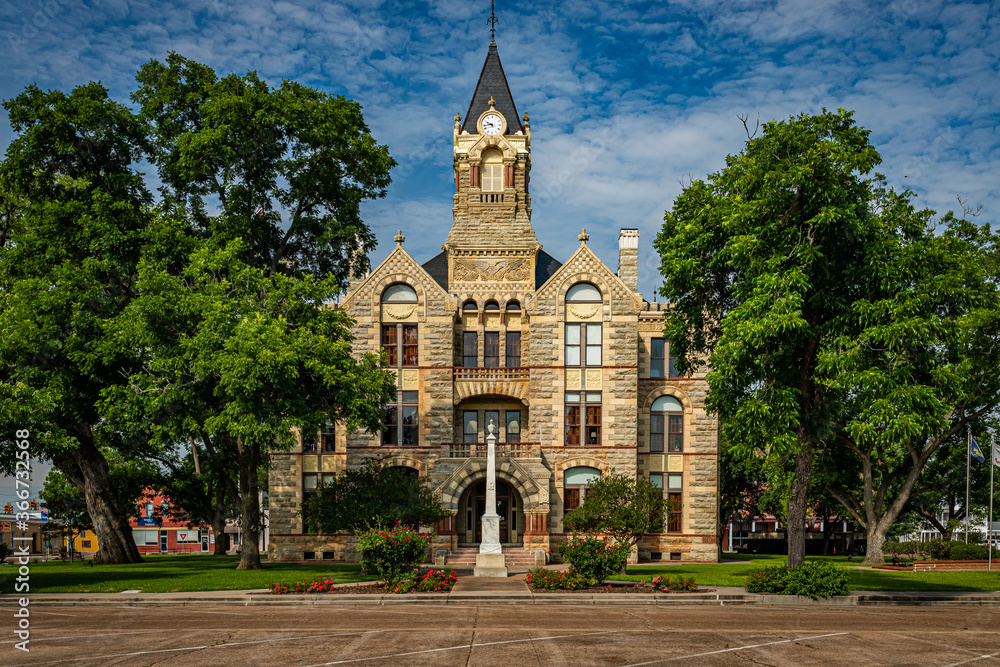 La Grange, Texas / United States - May 31, 2020: East elevation of the historic Fayette County Courthouse in LaGrange, Texas.