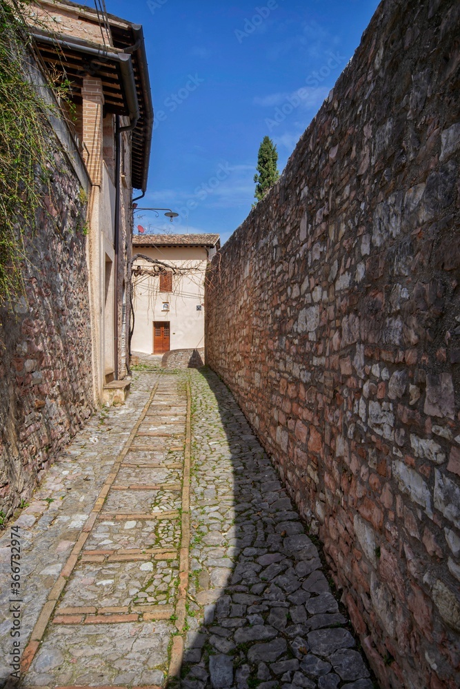 narrow street in the old town of Spello, Umbria, Italy 