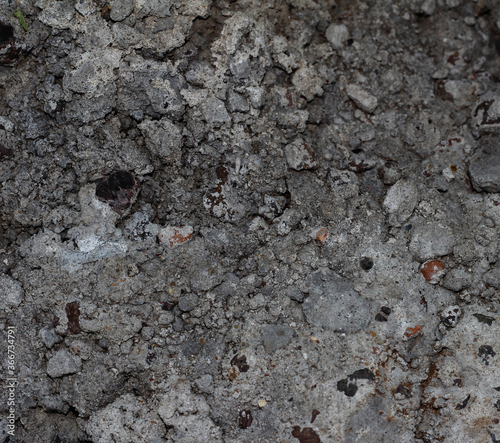 The texture of the concrete. Grey stone background. The texture of the concrete. Grey stone background.