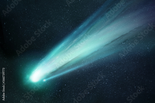 Comet Neowise passing the sun and releasing gases creating a tail and coma. Illustration. photo
