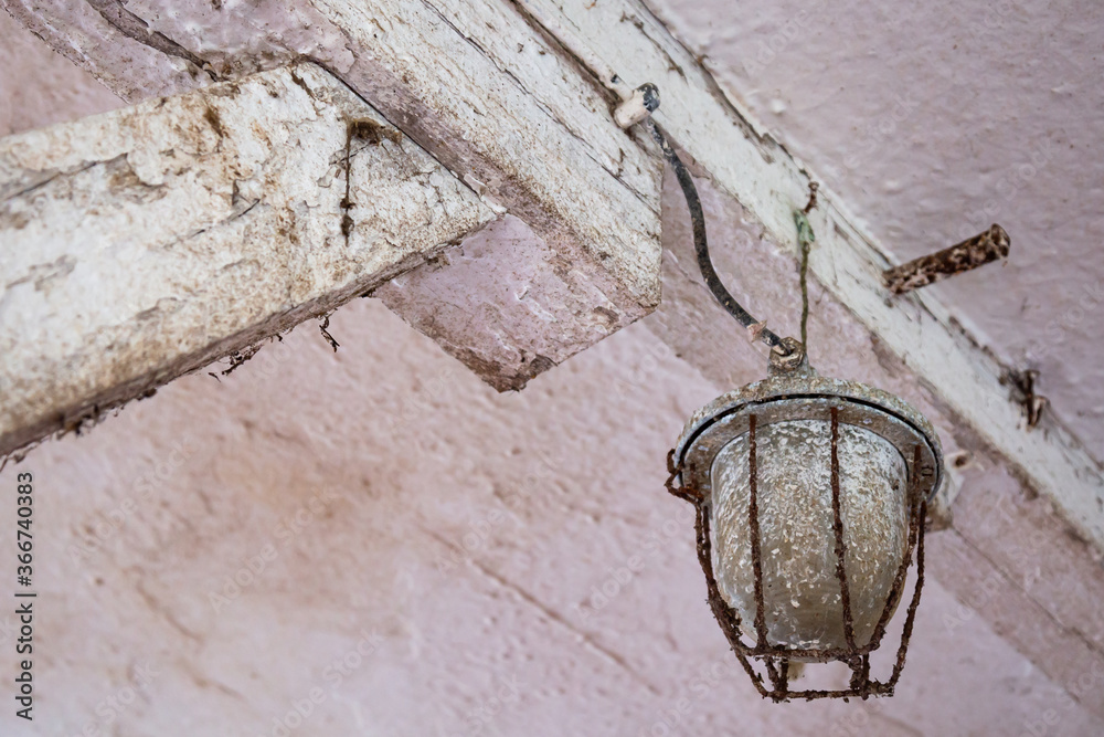 Old glass , ceiling light in forgotten farm