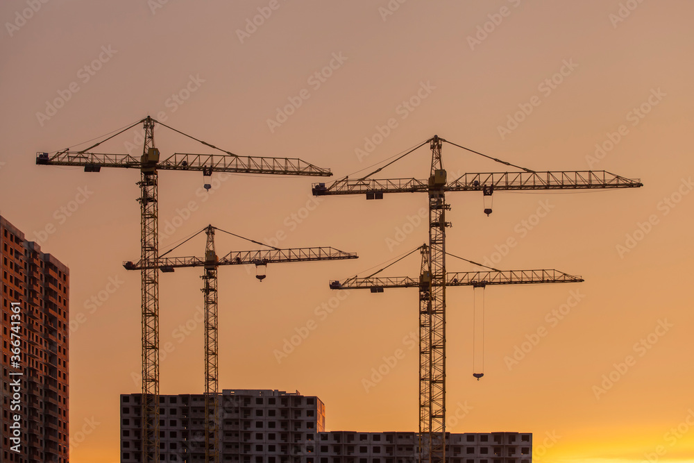 construction cranes against the background of bright evening clouds
construction cranes against the background of bright evening clouds