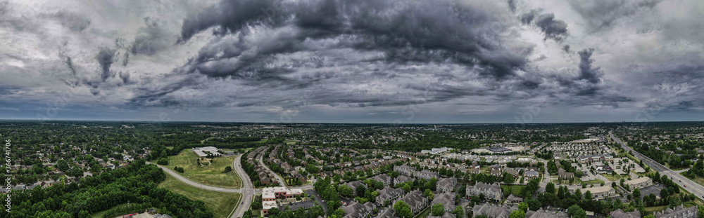 Aerial panorama of Lexington, Kentucky suburbs during dramatic clouds morning