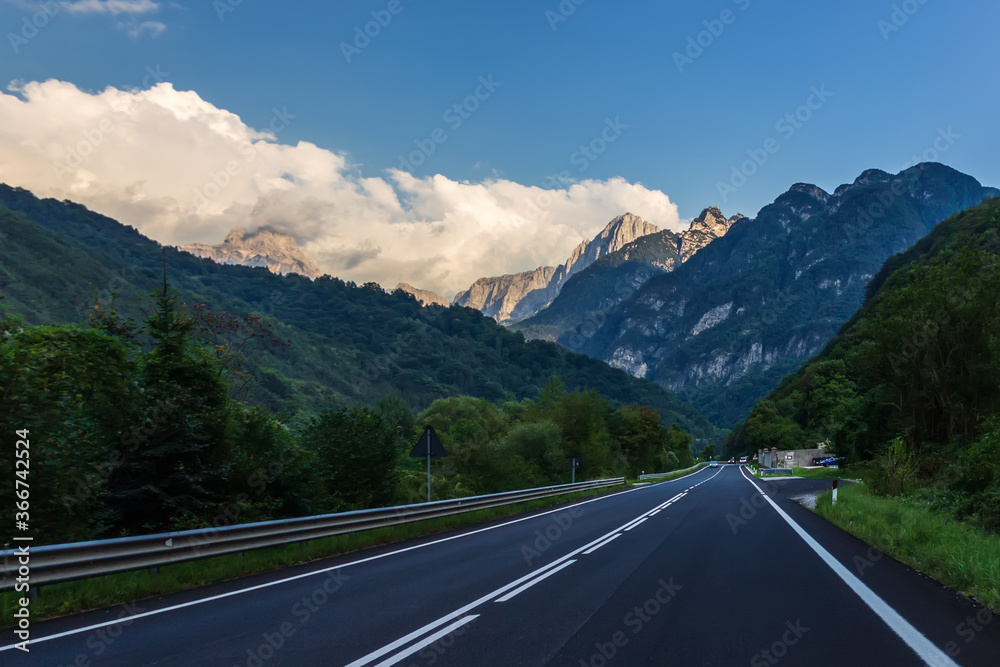Empty road in the Alps valley, Italy