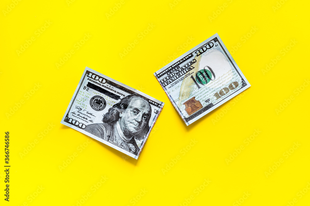 Cutting of US dollar banknote. Economic crisis concept Cutting of US dollar banknote. Economic crisis concept