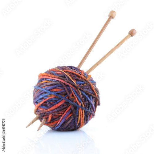 Ball of wool yarn with knitting needles