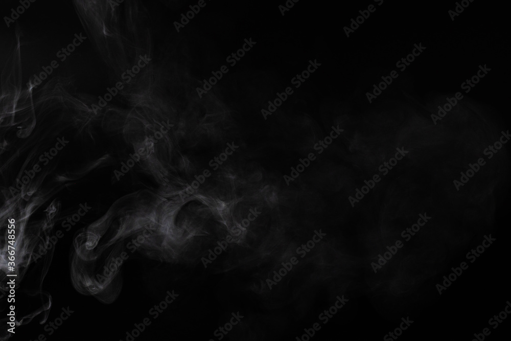 White steam on a black background. White steam on a black background.