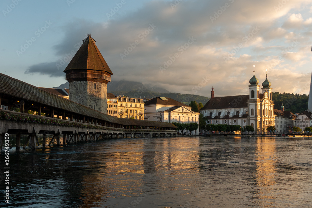Luzern bridge and medieval tower during sunset