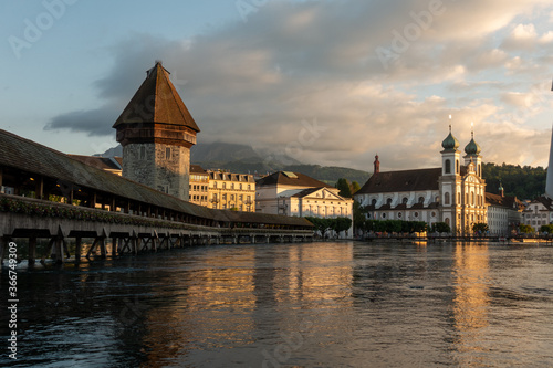 Luzern bridge and medieval tower during sunset
