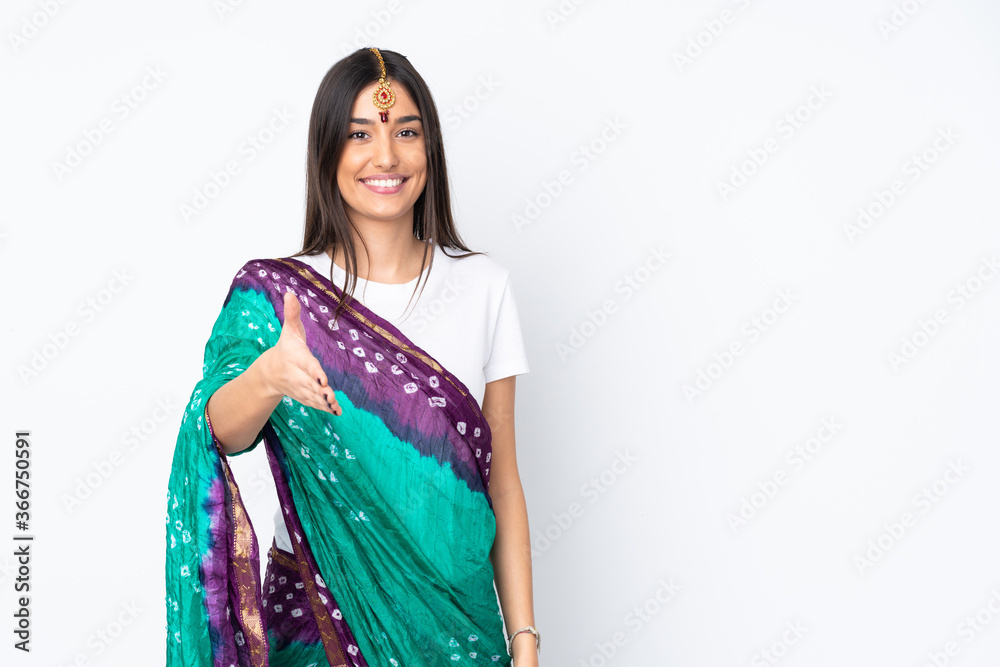 Young Indian woman isolated on white background shaking hands for closing a good deal Young Indian woman isolated on white background shaking hands for closing a good deal