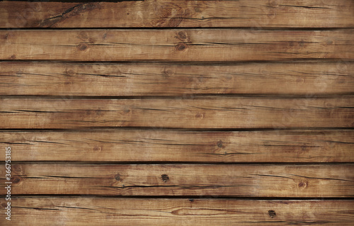 A brown wooden Board is laid out horizontally .Texture or background
