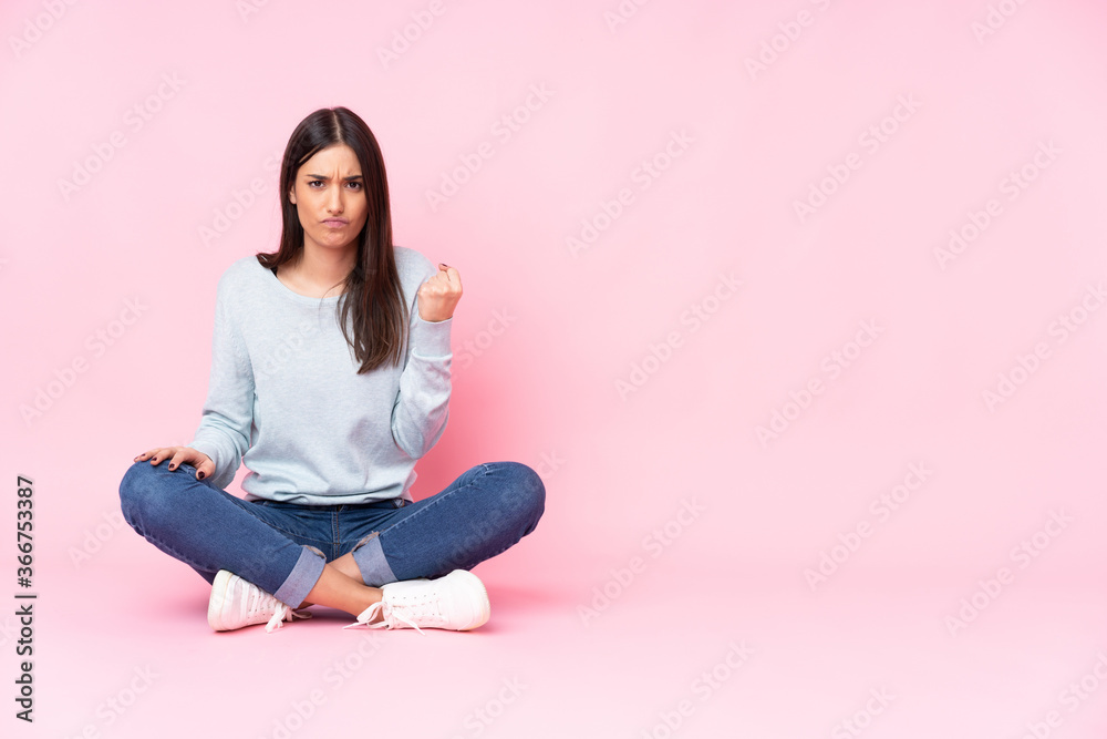 Young caucasian woman isolated on pink background with angry gesture Young caucasian woman isolated on pink background with angry gesture