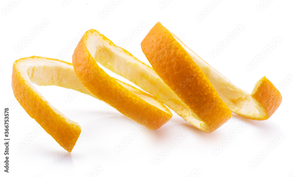 Orange peel or orange twist on white background. Close-up. Orange peel or orange twist on white background. Close-up.
