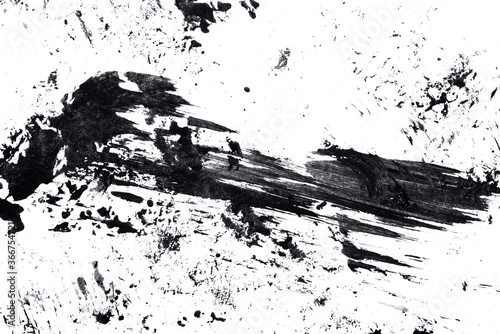 Abstract drops and smears of black acrylic paint isolated on a white background.
