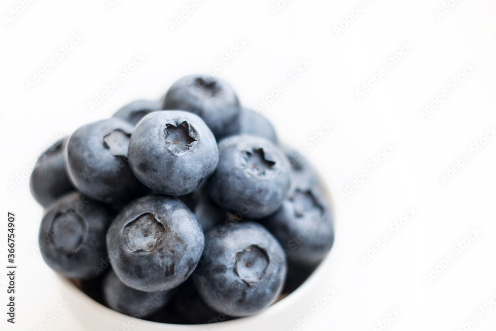 Fresh blueberry close-up isolated on a white background. Shallow depth of field. Healthy and dietary food concept. Fresh berries. Fresh blueberry close-up isolated on a white background. Shallow depth of field. Healthy and dietary food concept. Fresh berries.