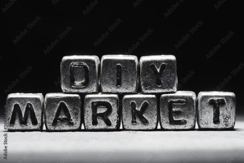 Naklejka premium Inscription DIY market on metal cubes in grunge style on a black темно серый background isolated