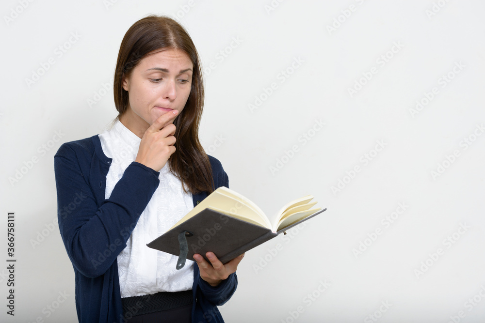 Portrait of young beautiful businesswoman against white background Portrait of young beautiful businesswoman against white background