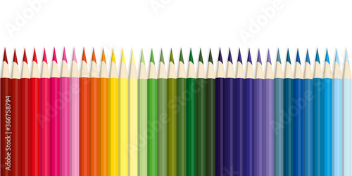 Colored pencils, lots of colors, the view from above. Pencils are arranged exactly in a row. Concept of creativity and education.