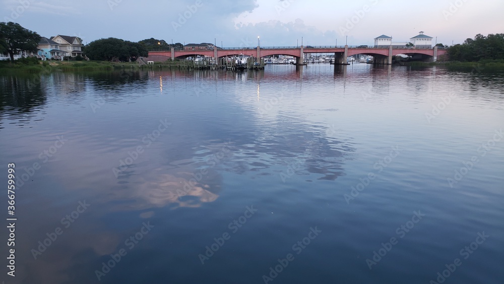Cloud reflection on still lake water