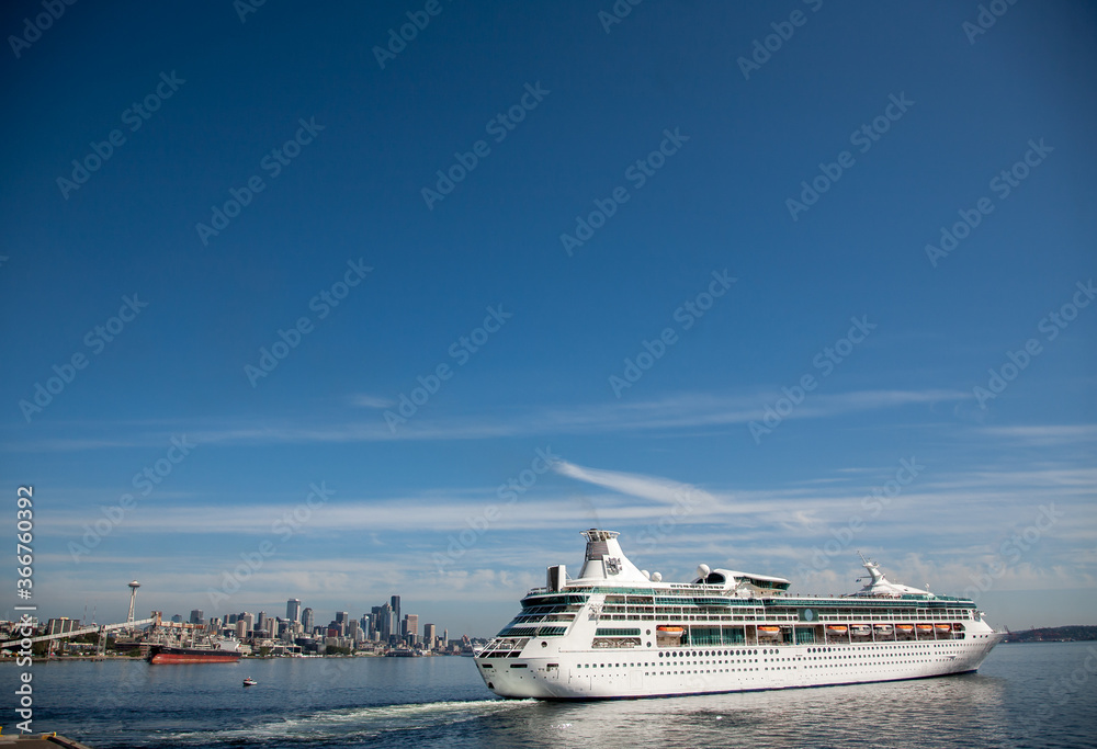 Seattle, Washington, USA - 8/20/2010:  A cruise ship has just departed from Seattle, with Seattle in background.