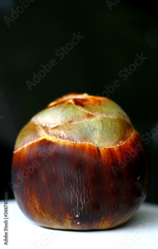 Borassus flabellifer or palmyra fruit on black background. photo