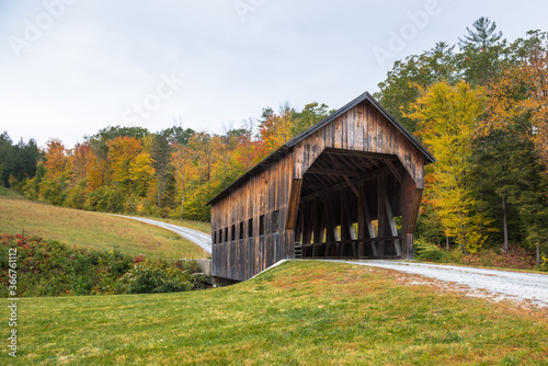 Old covered bridge in Vermont in autumn © alpegor