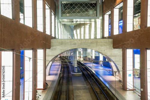 Interior of a multi-level train station. Empty curving tracks are visible at the low level. Antwerp, Belgium. photo