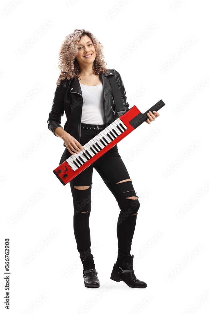 Young female musician playing a keytar synthesizer