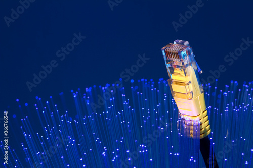 Fibre optic strands with a ethernet lan broadband cable, FTTP full fibre broadband concept photo