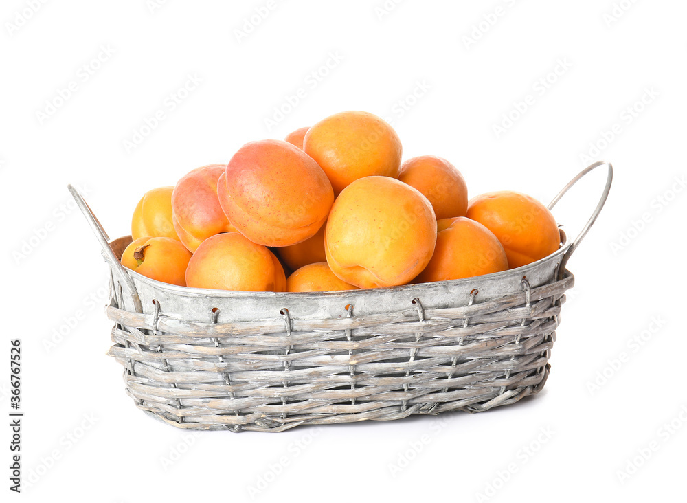 Basket with tasty ripe apricots on white background Basket with tasty ripe apricots on white background