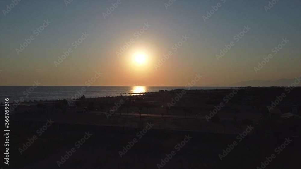 Flying over italian beach at sunset time drone shot Flying over italian beach at sunset time drone shot
