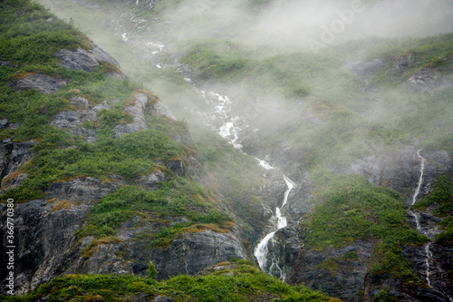 A small stream descend a mountain in Glacier Bay National Park and Preserve. It is a vast area of southeast Alaska’s Inside Passage