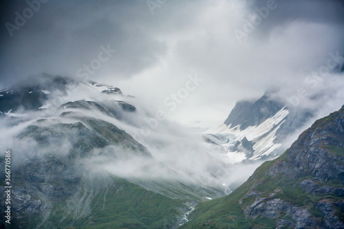 Mountains and fog in Glacier Bay National Park and Preserve.  It is a vast area of southeast Alaska   s Inside Passage