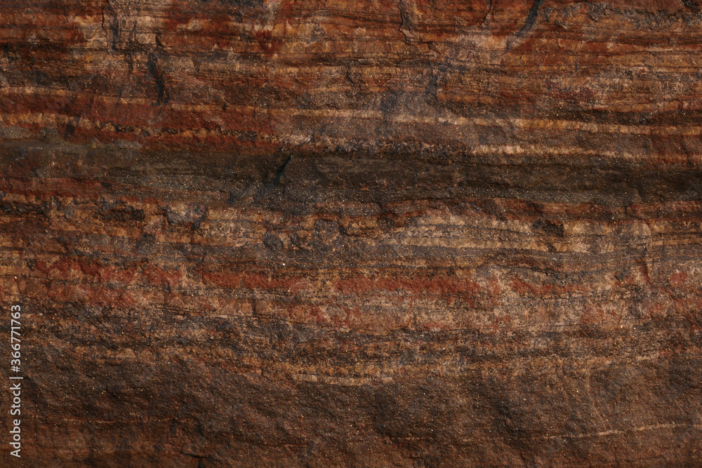 Minerals. Striped stone texture. Layered stones. Brown background. Blank for design. Textured background for interior decoration or packaging. Solid concept.