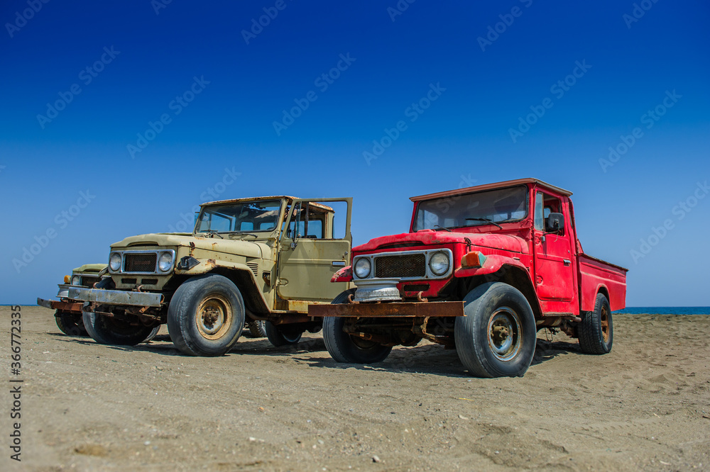 Old offroad suv car Jeep ideal for adventures with sea background