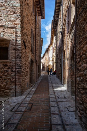 typical narrow street in the old town of Spello  Umbria  Italy