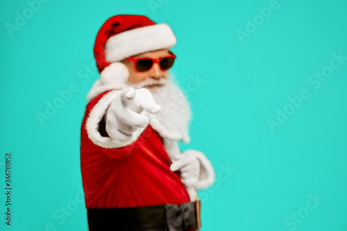 Santa Claus pointing at camera.
